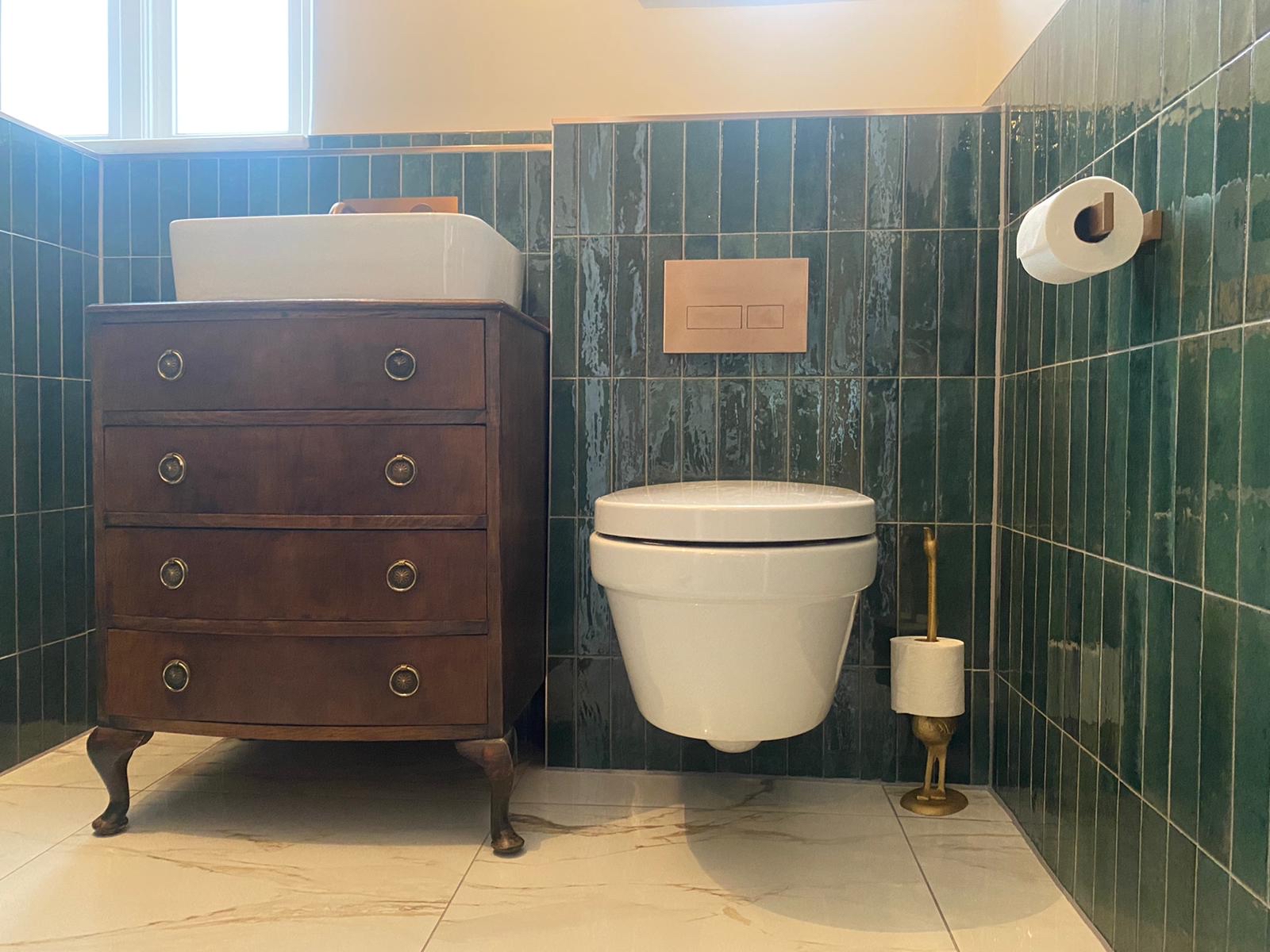 Reclaimed chest vanity · emerald tile