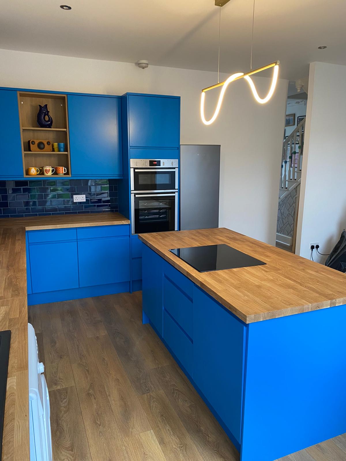 Cobalt blue kitchen · oak block